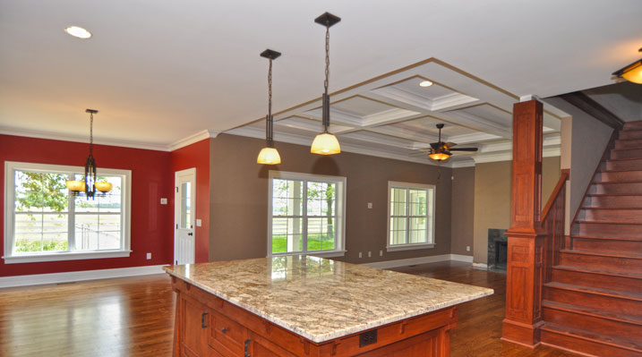 ICH Builders Mt. Sterling residence custom build looking over kitchen galley island towards the front of the house and the main living area